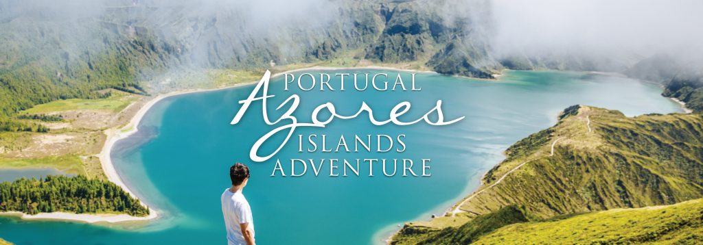 A man stands over Sete Cidades in the Azores Islands.