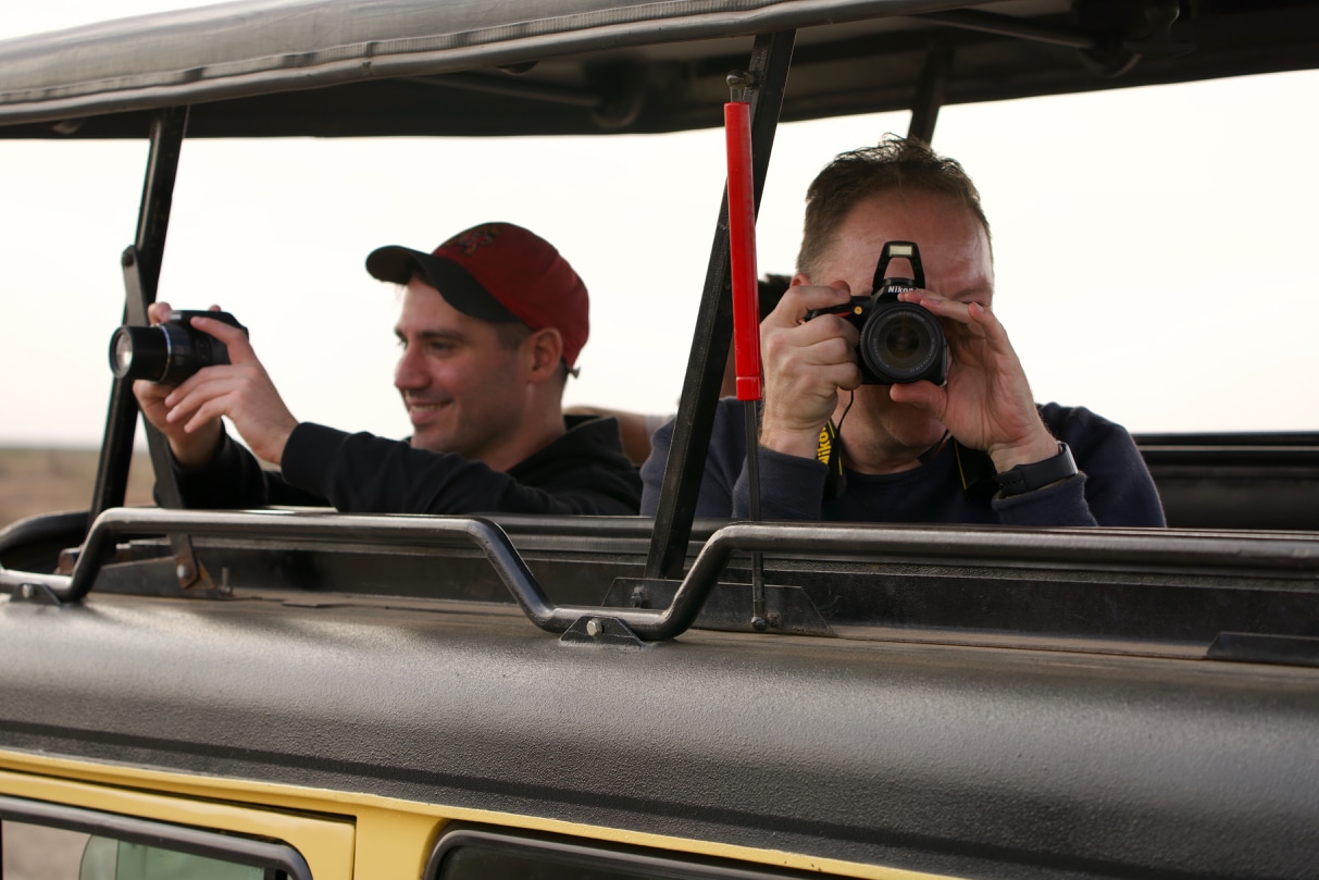 A man photographs whoever is taking the photo.