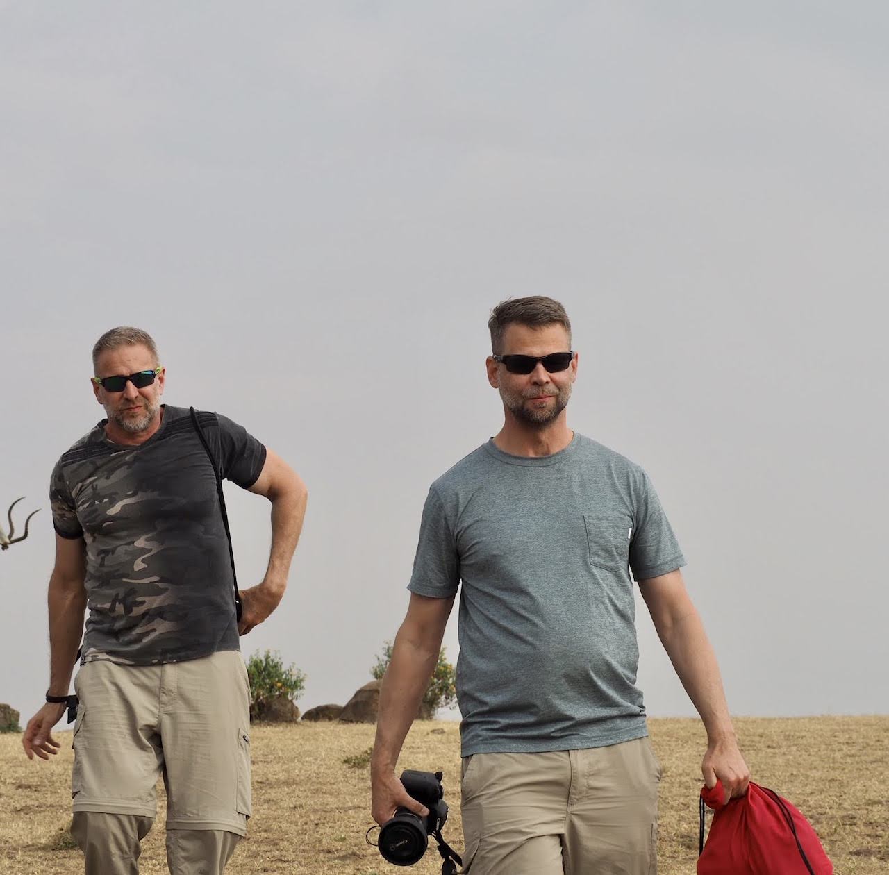 Two gay men take a stroll in Kenya.