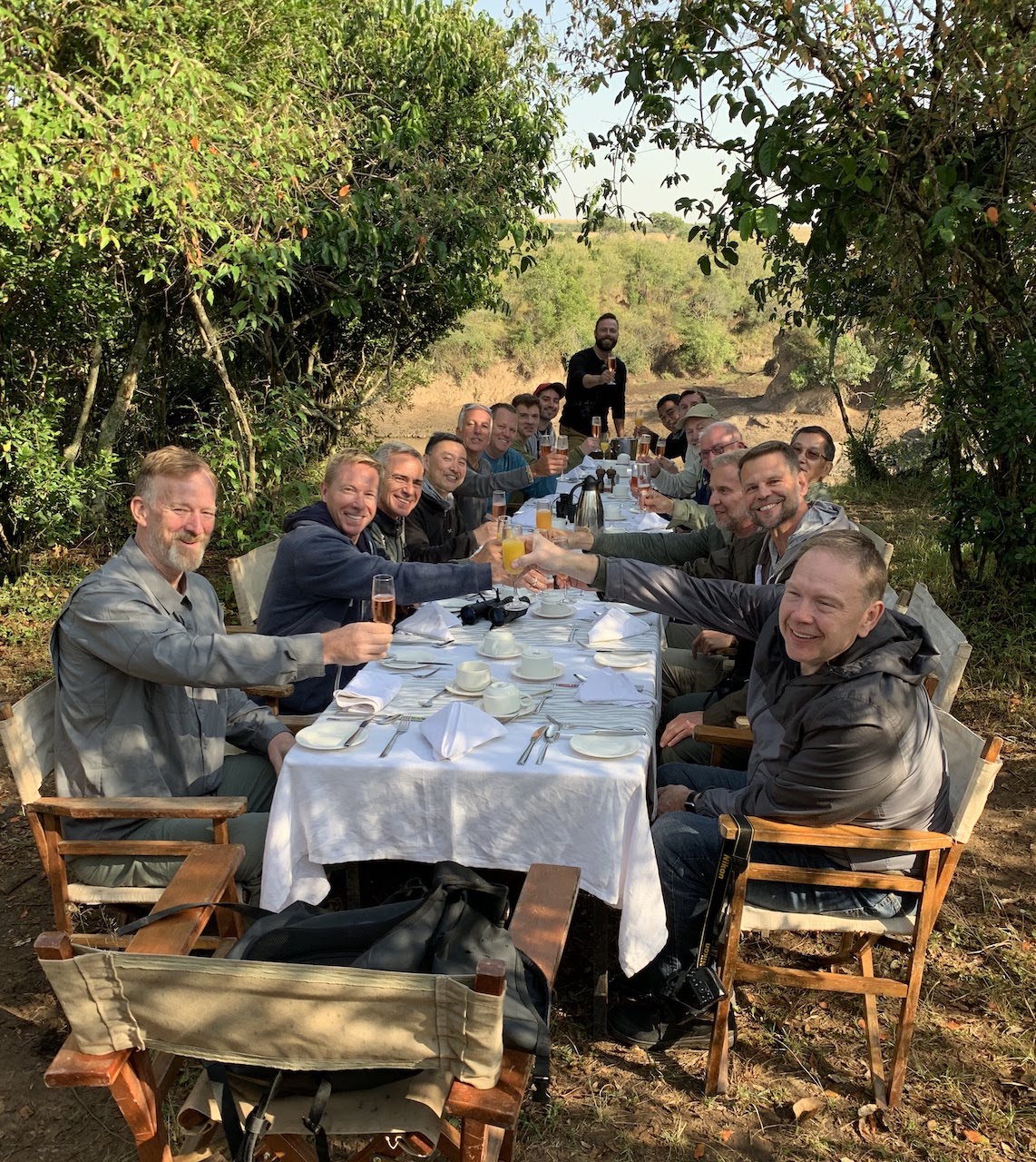 Travellers cheers each other at a unique bush lunch in Kenya.